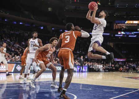 Apr 2, 2019; New York, NY, USA; Texas Christian Horned Frogs guard Alex Robinson (25) puts up a shot against the Texas Longhorns in the first half of the NIT semifinals at Madison Square Garden. Mandatory Credit: Wendell Cruz-USA TODAY Sports