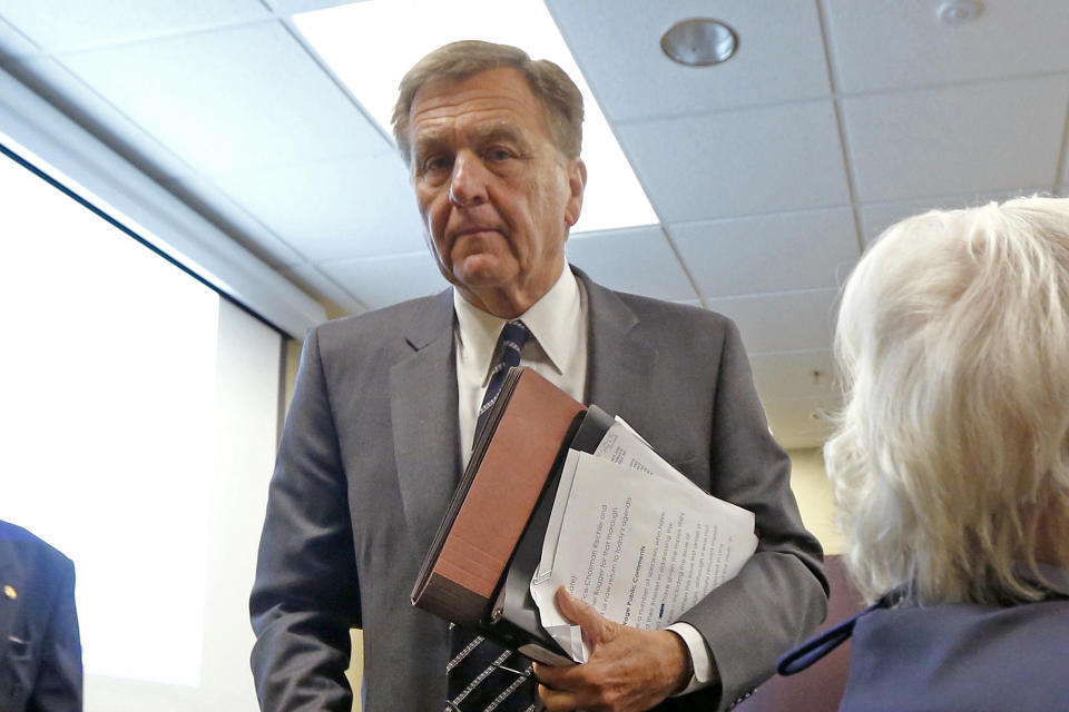 FILE – In this March 19, 2014, file photo, David Samson, chairman of The Port Authority of New York & New Jersey, walks out after excusing himself from a monthly meeting of the agency's board of commissioners, attended by protesters calling for Samson to resign, in Jersey City, N.J. Samson, who resigned later that month, is scheduled to be sentenced Monday, March 6, 2017, after he pleaded guilty July 14, 2016, to bribery for using his post to get United Airlines to run money-losing direct flights between Newark, N.J., and Columbia, S.C., saving him an hour's driving time to his weekend home. (AP Photo/Julio Cortez, File)