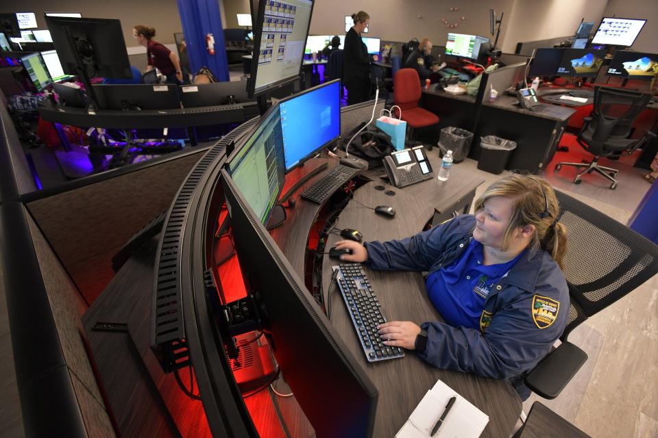 Jessica Carden, a police emergency communications officer, works her station in the communications center at the Jacksonville Sheriff's Office on Aug. 31.