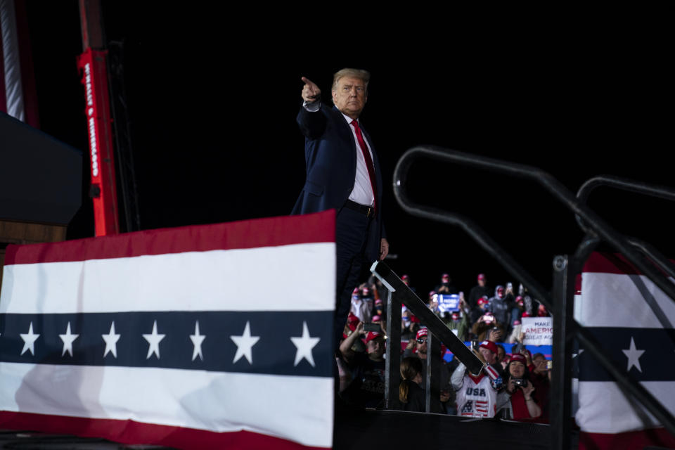 FILE - In this Sept. 10, 2020, file photo President Donald Trump points to the crowd after speaking during a campaign rally at MBS International Airport, in Freeland, Mich. (AP Photo/Evan Vucci, File)