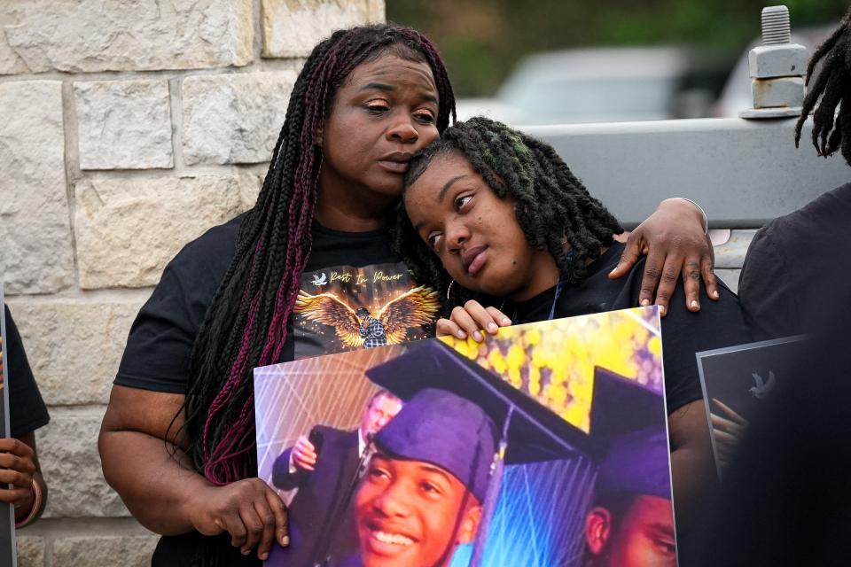 Shanta Miller hugs daughter Miriam Williams at a vigil Thursday for Shanta's son Malachi Williams outside San Marcos City Hall. Malachi Williams was killed April 11 by a San Marcos police officer who said the 22-year-old man was brandishing a knife.