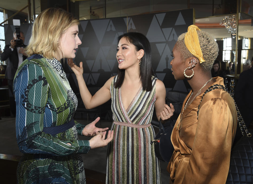 Actor-director Greta Gerwig, left, chats with actors Constance Wu and Cynthia Erivo at the Academy of Motion Picture Arts and Sciences Women's Initiative New York luncheon at the Rainbow Room on Wednesday, Oct. 2, 2019, in New York. (Photo by Evan Agostini/Invision/AP)