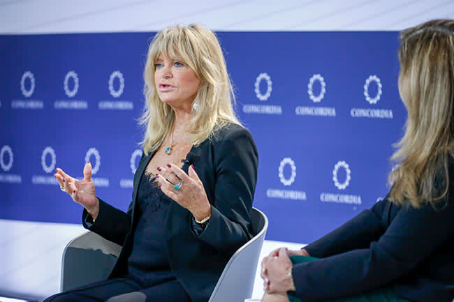 Goldie Hawn speaking at a summit