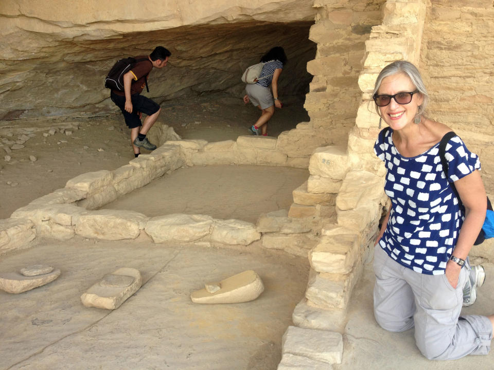 This August 2012 photo shows Karen Matthews at Balcony House, Mesa Verde National Park. The tools called manos and metates, excavated there, were used for grinding corn. Matthews, her mother and daughter took a road trip through the Four Corners region of the Southwest U.S. to visit places connected to Native American culture, both ancient and contemporary. (AP Photo/Margaret Matthews)