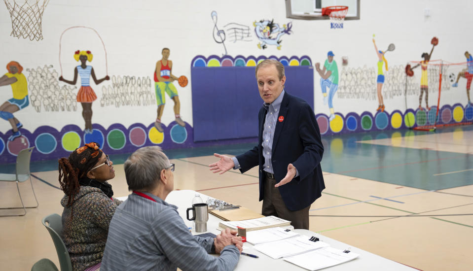 Minnesota Secretary of State Steve Simon visits election workers at Dayton's Bluff Recreation Center, a polling place in Ramsey County, as voters cast ballots for the 2024 Presidential Nominating Primary. Tuesday, March 5, 2024, St. Paul, Minn. (Glenn Stubbe/Star Tribune via AP)
