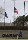 Flags are at half staff at Garmin headquarters Olathe, Kan., Friday, Feb. 24, 2017. Srinivas Kuchibhotla was employed at the company. He was killed in a shooting at a bar on Wednesday night. Witnesses say a man accused of opening fire in a crowded bar yelled at two Indian men to “get out of my country” before pulling the trigger. The attack killed one of the men and wounded the other, as well as a third man who tried to help. (AP Photo/Orlin Wagner)