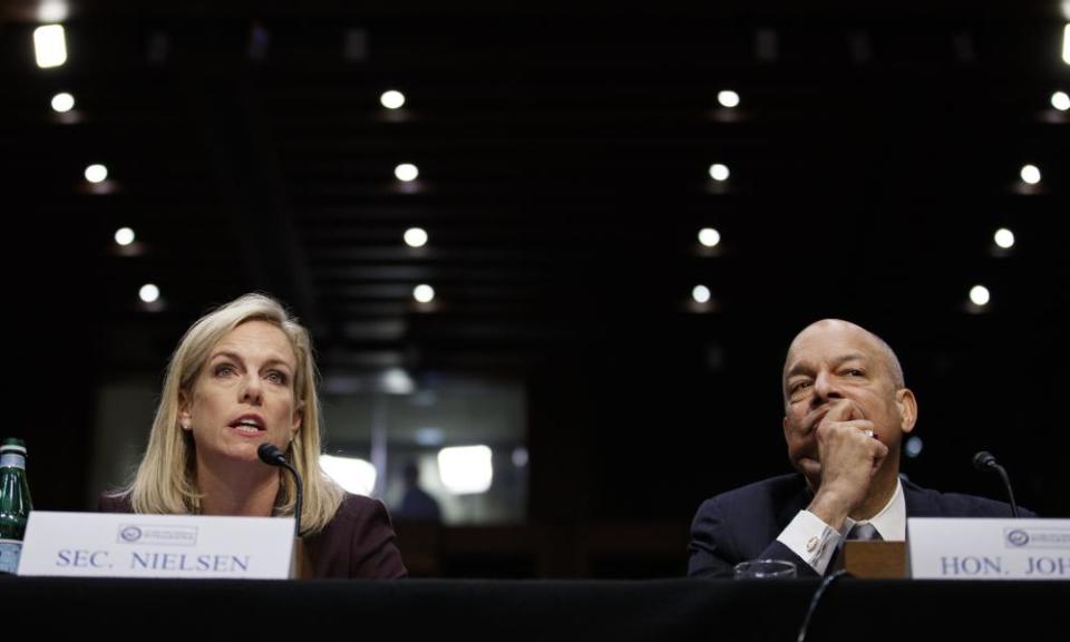 Kirstjen Nielsen, the homeland security secretary, and her predecessor Jeh Johnson appear before a Senate intelligence committee hearing on election security on Capitol Hill Wednesday.