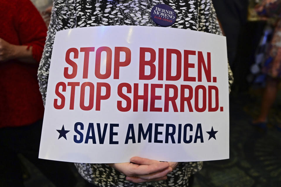 Kristin Kemper holds a sign during a watch party for Cleveland businessman Bernie Moreno, a Republican candidate for U.S. Senate, during his primary election night watch party in Westlake, Ohio, Tuesday, March 19, 2024. (AP Photo/David Dermer)