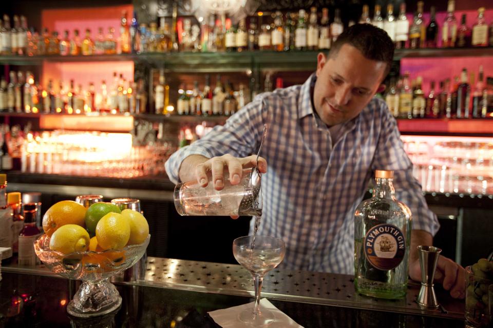 In this photo taken Thursday, Dec. 20, 2012, mixologist Jacques Bezuidenhout prepares a gin Martini cocktail in the Starlight Room of the Sir Francis Drake Hotel in San Francisco. The first rule of drinking on a diet is, don't. Surely you saw the recent study that found that Americans were getting almost as many empty calories from alcohol as from soft drinks. The second rule of drinking on a diet is that since you probably will ignore Rule No. 1, find a way to enjoy alcohol without letting it swamp your healthy intentions. (AP Photo/Eric Risberg)