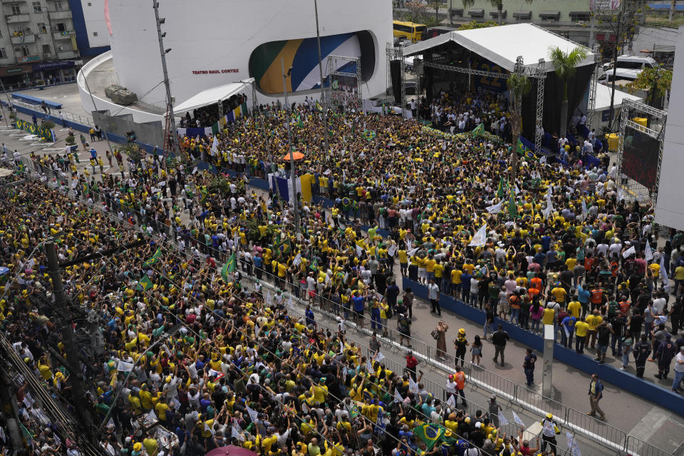 Brazilian President Jair Bolsonaro holds a campaign event for reelection in Duque de Caxias, Rio de Janeiro state, Brazil, Friday, Oct. 14, 2022. The presidential run-off election is set for Oct. 30. (AP Photo/Silvia Izquierdo)