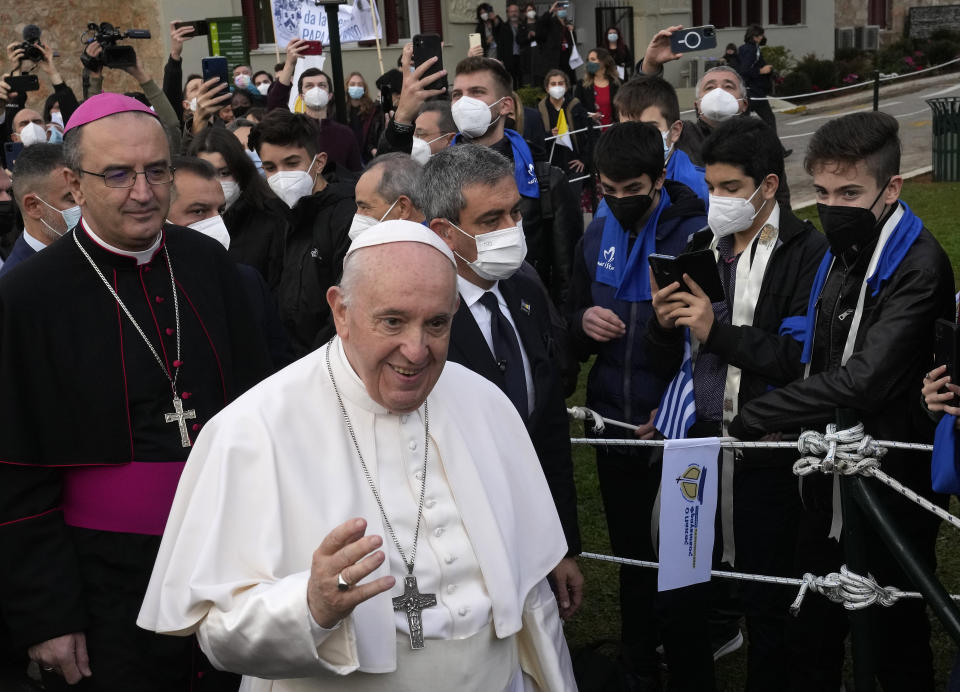 Pope Francis arrives for a meeting with young people at the Saint Dionysius School of the Ursuline Sisters in Athens, Greece, Monday, Dec. 6, 2021. Francis' five-day trip to Cyprus and Greece has been dominated by the migrant issue and Francis' call for European countries to stop building walls, stoking fears and shutting out "those in greater need who knock at our door." (AP Photo/Alessandra Tarantino)