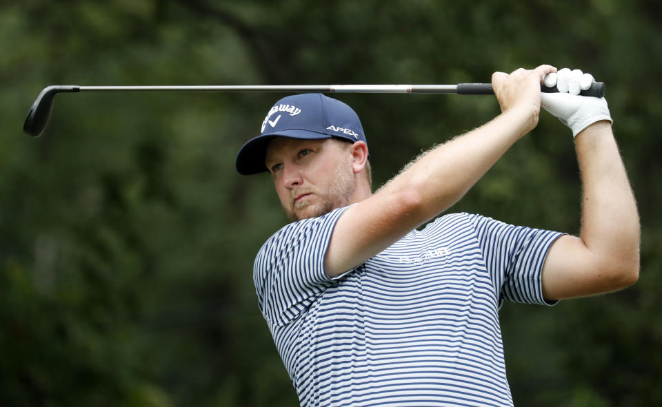 Brice Garnett watches his tee shot on the fourth hole hole during the third round of the Wyndham Championship golf tournament at Sedgefield Country Club in Greensboro, N.C. Saturday, Aug. 3, 2019. (AP Photo/Chris Seward)