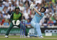 England's captain Eoin Morgan plays a shot for six off the bowling of South Africa's Aiden Markram during the World Cup cricket match between England and South Africa at The Oval in London, Thursday, May 30, 2019. (AP Photo/Kirsty Wigglesworth)