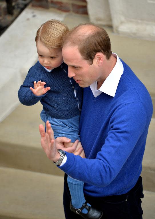 Prince William and his son Prince George wave outside the Lindo Wing at St Mary's Hospital, on May 2, 2015