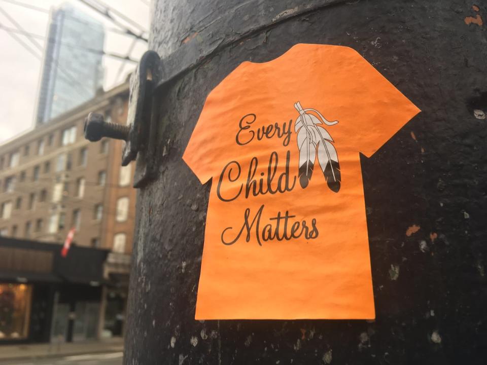 ‘Every Child Matters’ sticker posted on a lamp post in downtown Vancouver near the Vancouver Art Gallery. 