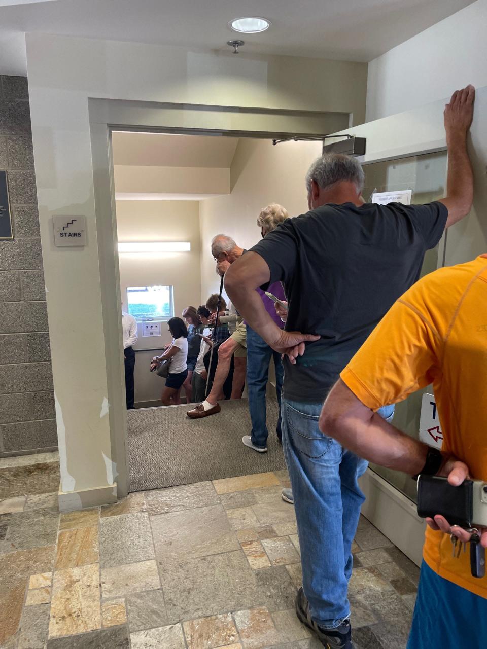 Scene in Jackson, Wyoming on August 15, 2022 as voters stand in line for early voting in the primary. There is interest in the Cheney-Hageman race - the line for early voting Monday at the Teton County building is up the stairs and nearly out the door.