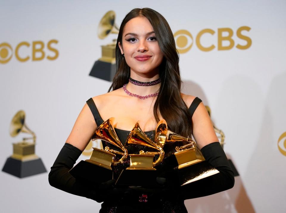 Olivia Rodrigo poses at the 64th Annual Grammy Awards on 3 April in Las Vegas (AP)