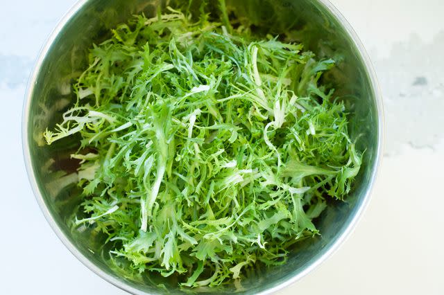 <p>Simply Recipes / Alison Bickel</p> A bowl of curly endive, ready for salad.