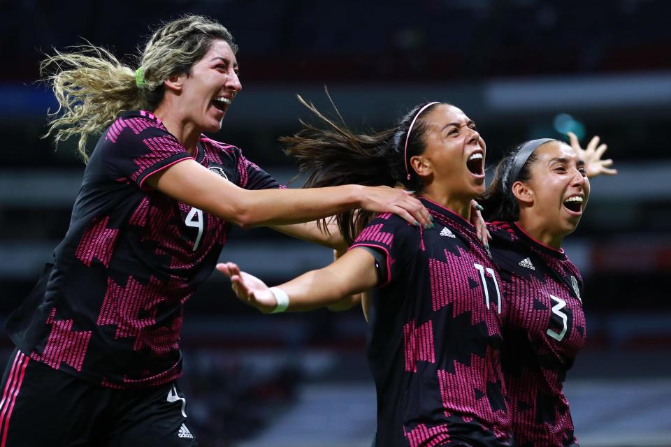 Maria Sanchez of Mexico celebrates with teammates after scoring the second goal of her team against Colombia.