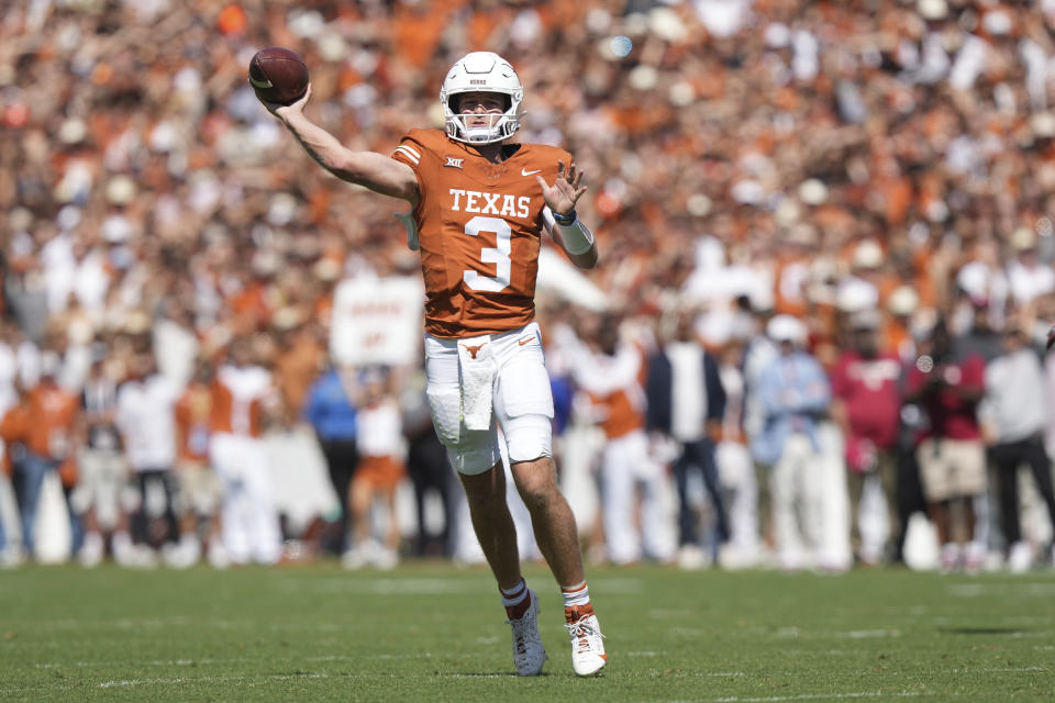 Texas quarterback Quinn Ewers (3) throws a pass during the first half of an NCAA college football game against Oklahoma at the Cotton Bowl in Dallas, Saturday, Oct. 7, 2023. (AP Photo/LM Otero)