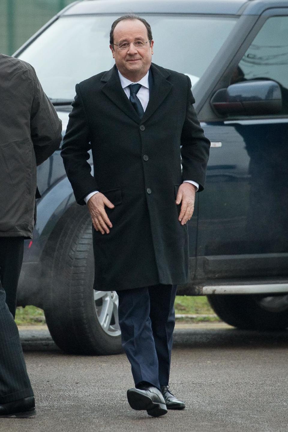 French President Francois Hollande arrives ahead of a meeting with British Prime Minister David Cameron, during a one day summit at RAF Brize Norton, England Friday Jan. 31, 2014. British Prime Minister David Cameron and French President Francois Hollande are expected to discuss military cooperation during the one-day summit. (AP Photo / Leon Neal)