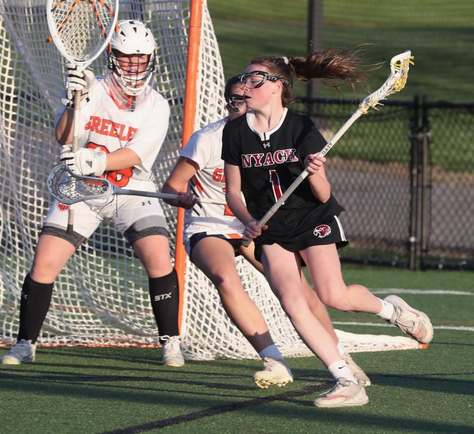 Nyack's Casey Cummings is pressured by Horace Greeley's  Stella Potenza during their game at Horace Greeley April 25, 2023. Nyack won 16-6.