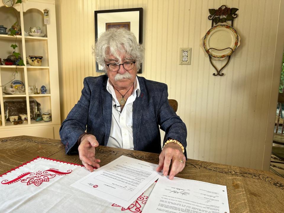 Robert Thivierge shows an agreement between him and the Quebec College of Physicians which bars him from practising medicine after August 1, 2023. 