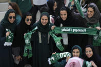 FILE - Saudi women supporters celebrate after Saudi Arabia won the World Cup group C soccer match between Argentina and Saudi Arabia at the Lusail Stadium in Lusail, Qatar, on Nov. 22, 2022. For a brief moment after Saudi Arabia's Salem Aldawsari fired a soccer ball from just inside the penalty box into the back of the net to seal a win against Argentina, Arabs across the divided Middle East found something to celebrate. (AP Photo/Luca Bruno, File)