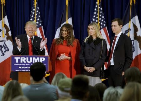 U.S. Republican presidential candidate Donald Trump speaks as (L-R) his wife Melania, daughter Ivanka and Ivanka's husband Jared Kushner listen, at a campaign rally on caucus day in Waterloo, Iowa February 1, 2016. REUTERS/Rick Wilking