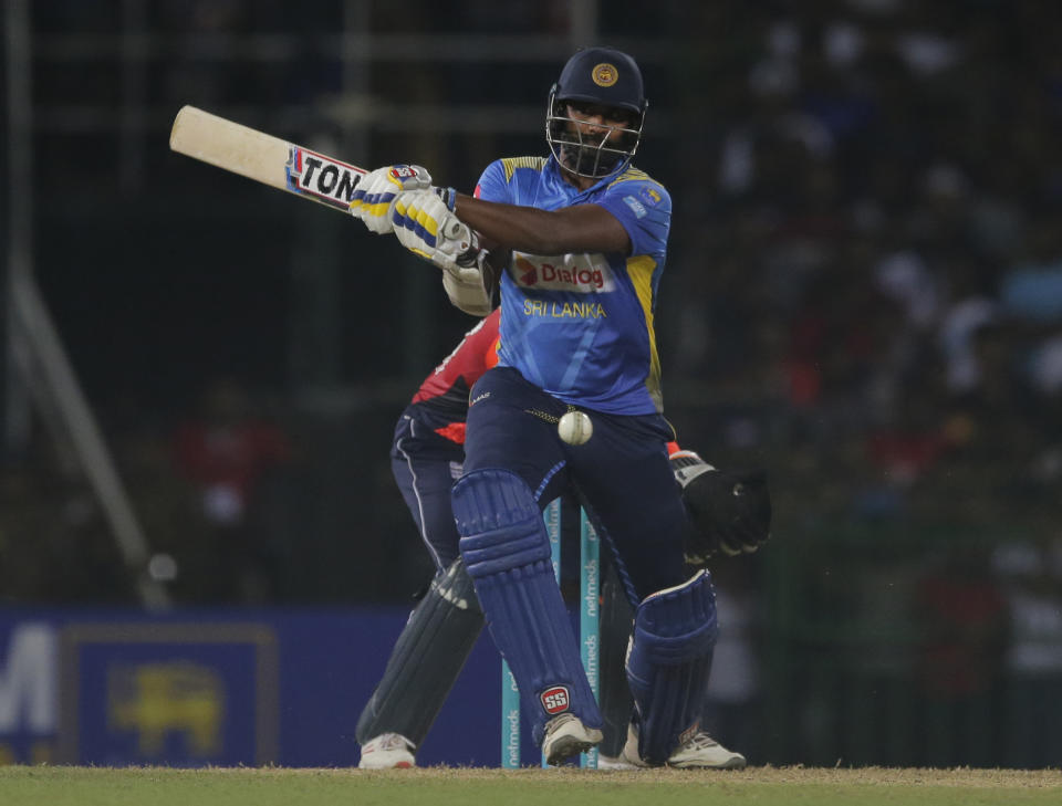 Sri Lanka's Thisara Perera plays a shot during the Twenty20 international cricket match between Sri Lanka and England in Colombo, Sri Lanka, Saturday, Oct. 27, 2018. (AP Photo/Eranga Jayawardena)