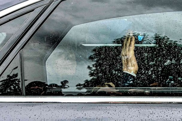 PHOTO: Former Italian premier Silvio Berlusconi waves from inside his car as he leaves on May 19, 2023 the San Raffaele hospital in Milan after being discharged. (Piero Cruciatti/AFP via Getty Images)