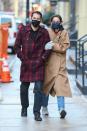 <p>Katie Holmes holds onto boyfriend Emilio Vitolo Jr. in New York City on Monday.</p>