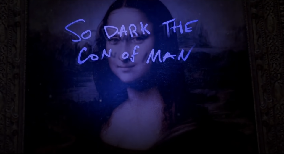 A painting of The Mona Lisa with "So dark the con of man" written on it