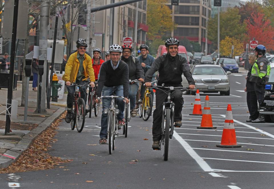 Providence Mayor Jorge Elorza, right, and other bike advocates ride in a bike lane on Fountain Street at its opening in 2016, part of the mayor's "Great Streets" initiative to bring new bike lanes to the city.