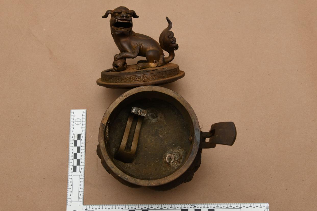 The FBI identifies this item as a "metal incense burner." These 22 items recovered in Massechusetts are believed to be among a repository of documents and treasures of the Ryukyu Kingdom taken during WWII. They'd be registered as stolen with the FBI in 2001.