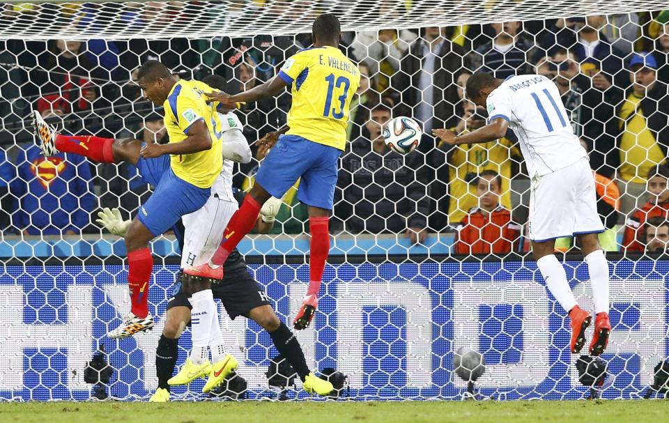 Ecuador's Enner Valencia (13) heads to score a goal during the 2014 World Cup Group E soccer match between Honduras and Ecuador at the Baixada arena in Curitiba June 20, 2014. REUTERS/Darren Staples (BRAZIL - Tags: TPX IMAGES OF THE DAY SOCCER SPORT WORLD CUP)