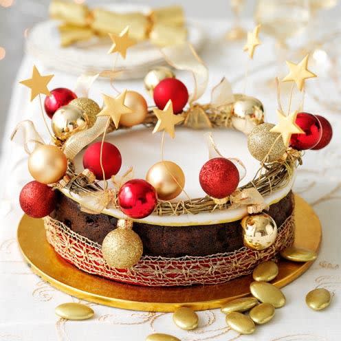 <p>This versatile wreath decoration can be lifted off the cake and used again.</p><p><strong>Recipe: <a href="https://www.goodhousekeeping.com/uk/food/recipes/christmas-cake-decoration-golden-wreath" rel="nofollow noopener" target="_blank" data-ylk="slk:Golden Wreath Christmas cake;elm:context_link;itc:0;sec:content-canvas" class="link ">Golden Wreath Christmas cake</a> </strong><br><br></p>