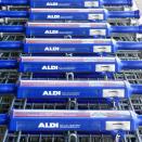 <p>If you want to use a cart at Aldi, you have to pay a deposit. Each cart has a coin slot mounted on it, and by inserting a quarter, you unlock it from the cart ahead of it. This helps to prevent theft and encourages people to return carts to their corrals so they can get their quarter back.</p>