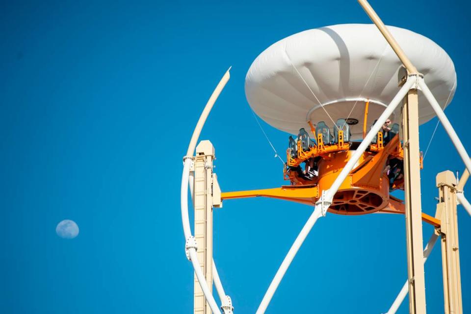 Park guests ride the Aerobar during the grand opening of Paradise Pier amusement park at Margaritaville in Biloxi on Friday, March 3, 2023.