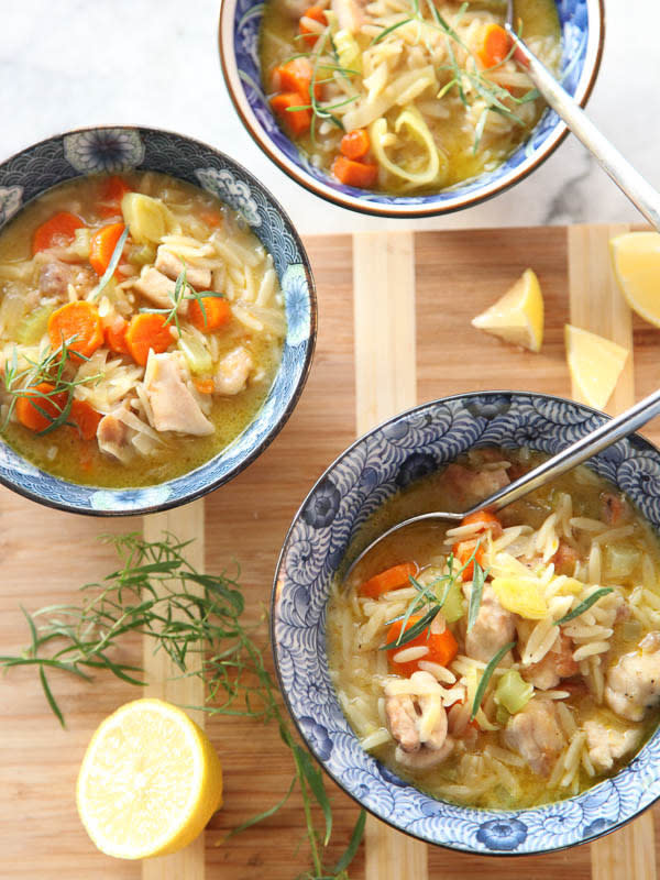 three bowls of the soup on a table