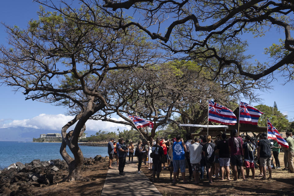 Lahaina, Hawaii, residents, who are affected by a deadly wildfire that devastated the community, gather for a news conference in Lahaina, Hawaii, Friday, Aug. 18, 2023. (AP Photo/Jae C. Hong)