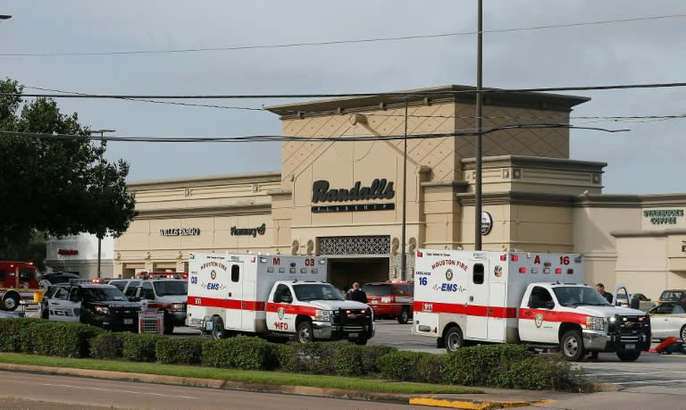 Ambulance crews on standby after a gunman went on a shooting rampage wounding nine before he was shot and killed by police on September 26, 2016 in Houston, Texas