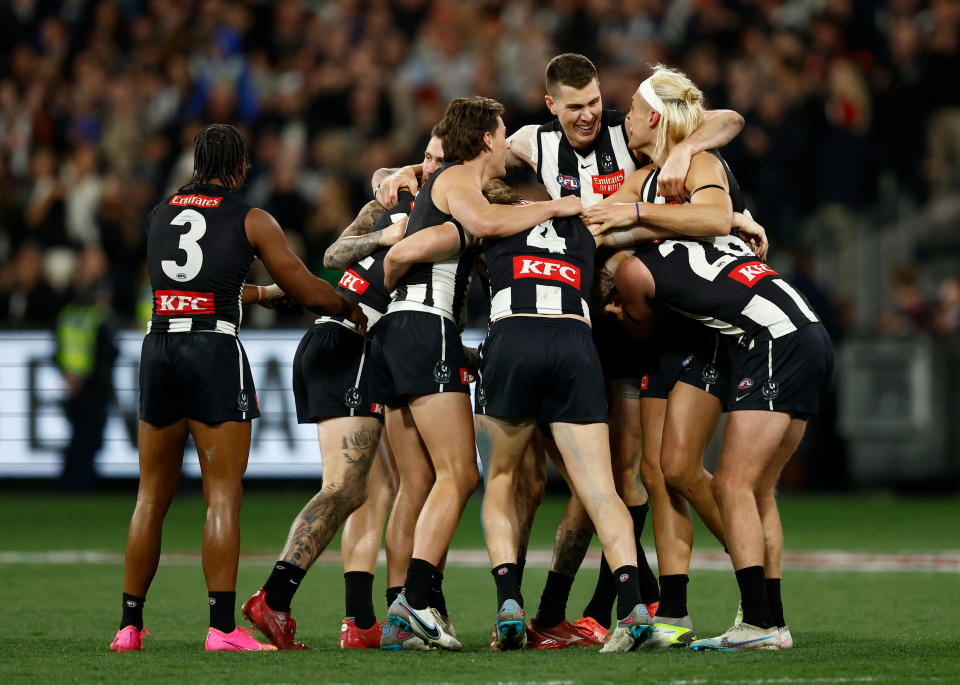 Darcy Moore celebrates.