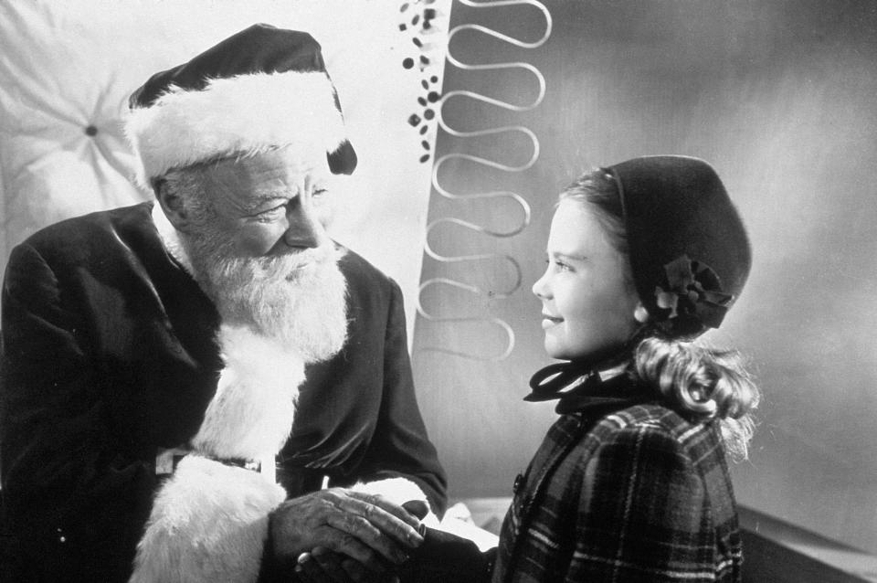 This undated promotional file photo provided by Fox Home Entertainment shows Actor Edmund Gwenn (left) as Kris Kringle greeting actress Natalie Wood in a scene from the 1947 film "Miracle on 34th Street."