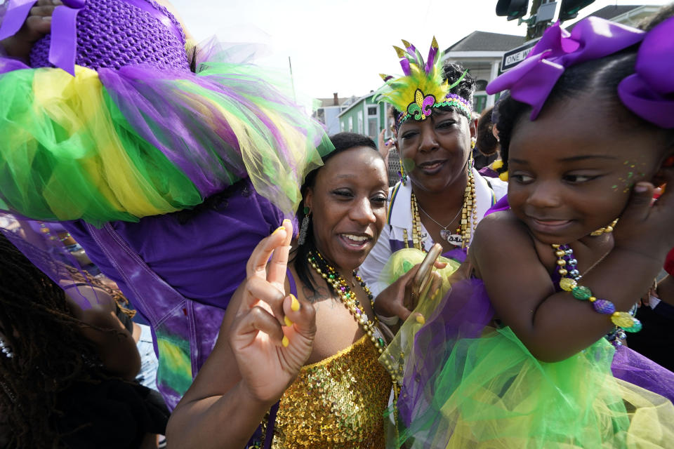 Revelers dance during the traditional Krewe of Zulu Parade on Mardi Gras Day in New Orleans, Tuesday, Feb. 21, 2023. (AP Photo/Gerald Herbert)