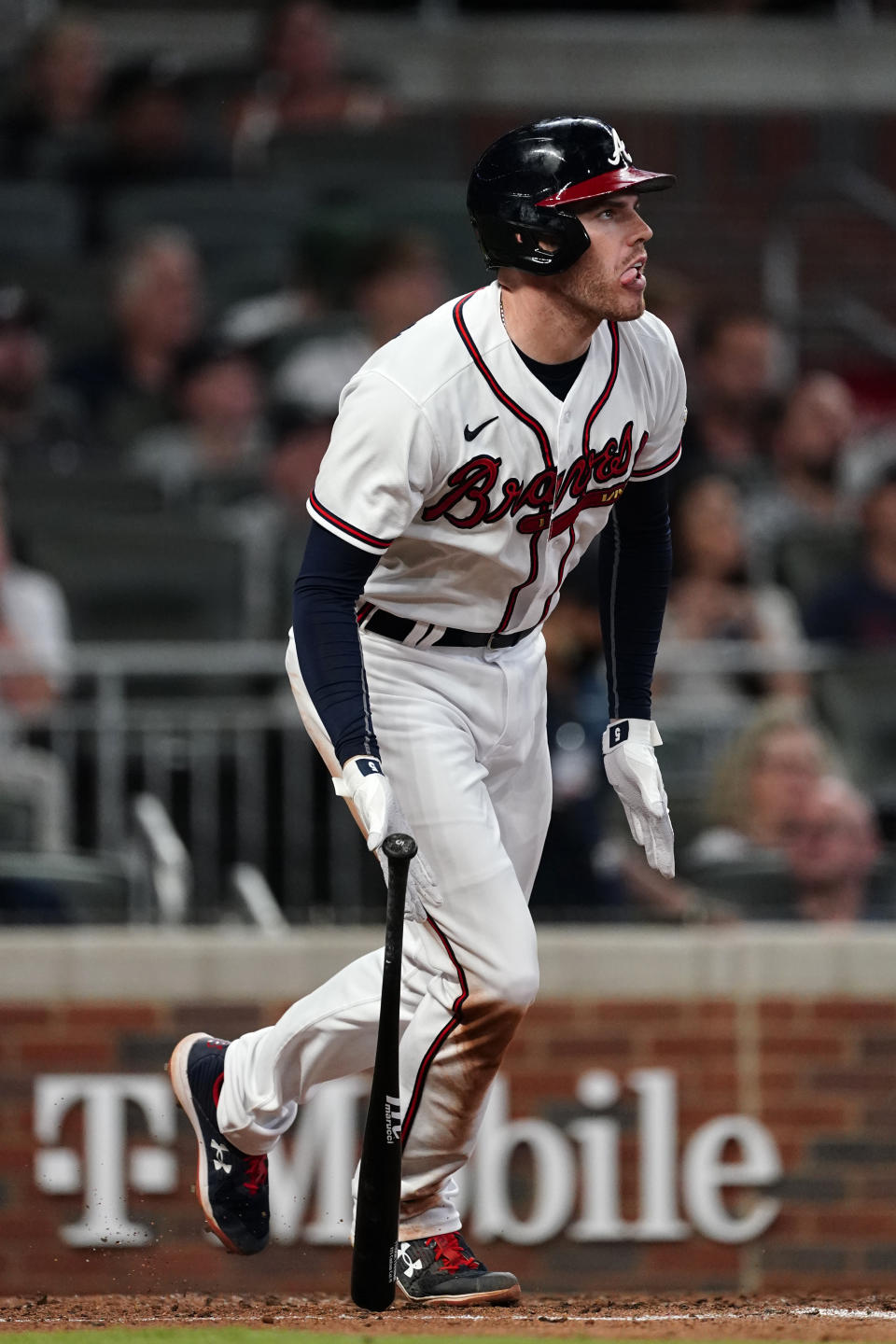 Atlanta Braves' Freddie Freeman runs to first after hitting a home run during the sixth inning of the team's baseball game against the New York Mets on Tuesday, May 18, 2021, in Atlanta. (AP Photo/John Bazemore)