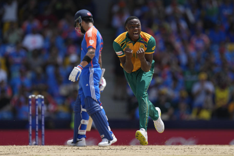 South Africa's Kagiso Rabada, right, celebrates the dismissal of India's Suryakumar Yadav during the ICC Men's T20 World Cup final cricket match between India and South Africa at Kensington Oval in Bridgetown, Barbados, Saturday, June 29, 2024. (AP Photo/Ricardo Mazalan)