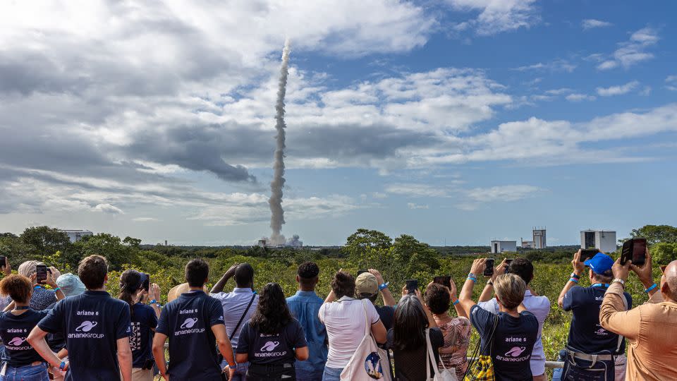 Spectators watch the takeoff of the Ariane 6 rocket from its launchpad at the Guiana Space Center on Tuesday. - Jody Amiet/AFP/Getty Images