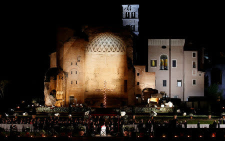 Pope Francis leads the Via Crucis (Way of the Cross) procession during Good Friday celebrations at the Colosseum in Rome, Italy March 30, 2018. REUTERS/Remo Casilli