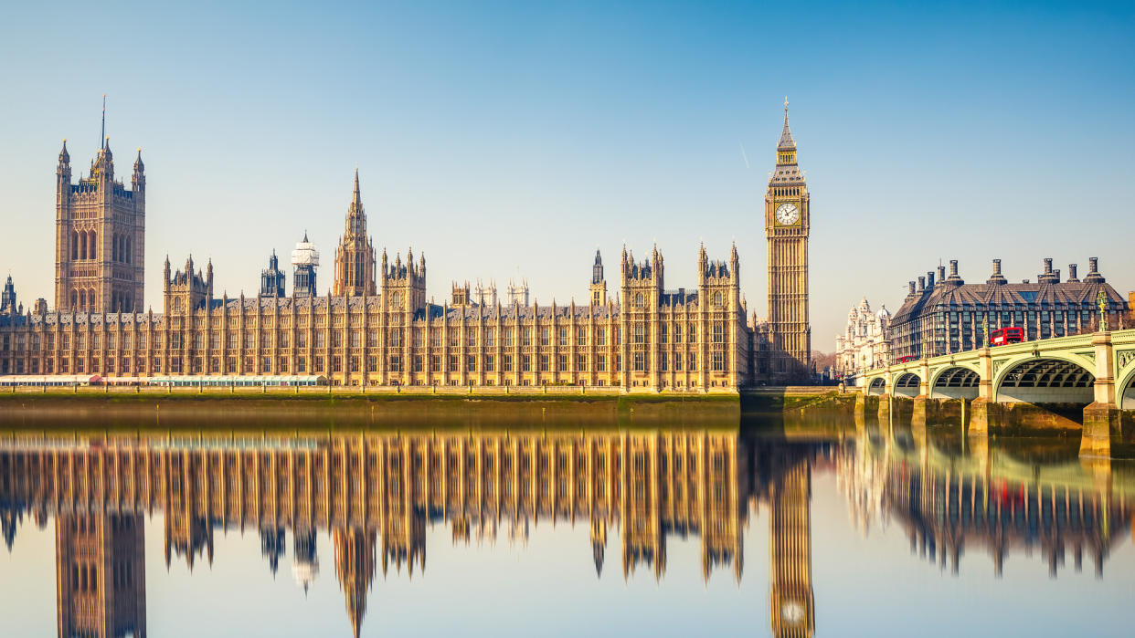 Big Ben and Houses of parliament at calm sunny morning.